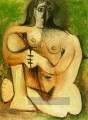 Femme nue accroupie sur fond vert 1960 Kubismus